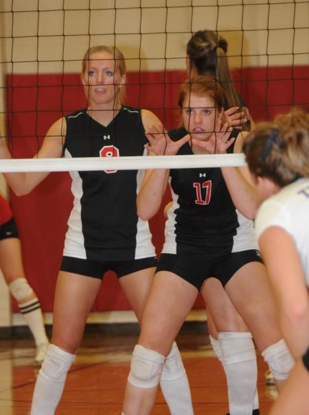 Amanda Hutchison Coyle and Anna Sims await the serve from their teammate during the championship game of the TranSouth Conference Tournament. - Photo by Morris Abernathy