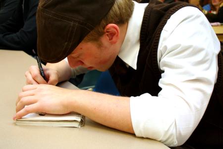 Benjamin Watson, junior art major, diligently sketches in his notebook during the annual art retreat. - Photo by Kristi McMurry Woody
