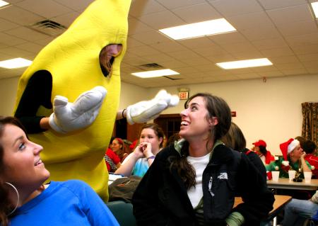 Michaela Witzke, sophomore art major, shows off her banana costume to Abby Priddy, junior art major, and Alanna Taylor, senior art major, at the annual art retreat. - Photo by Kristi McMurry Woody
