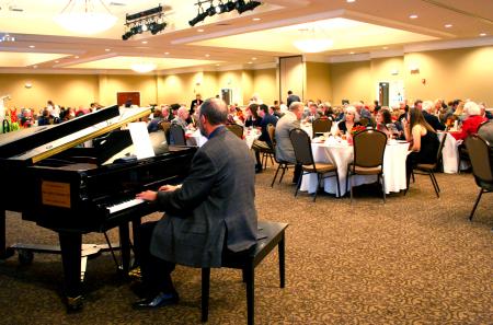 Attendees of the 2008 Hall of Fame Banquet enjoyed a feast catered by Aramark, while Terry McRoberts' music accompanied their meal. - Photo by Kristi McMurry Woody
