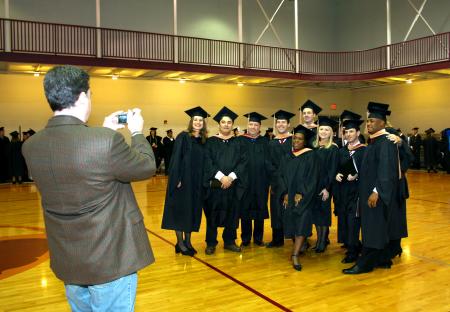 December graduates pose for a group photo before the commencement service begins.  - Photo by Kristi McMurry Woody