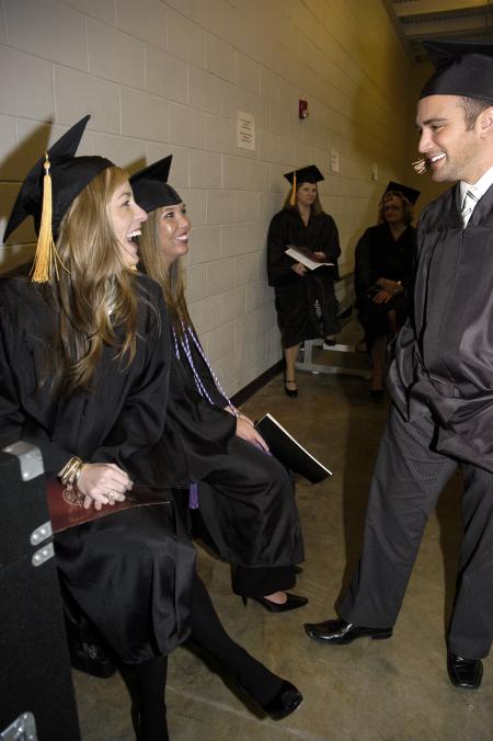 Rebecca Smith, Tiffany Smith and Chris Campbell fellowship while lining up for the fall graduation ceremony. - Photo by Beth Spain