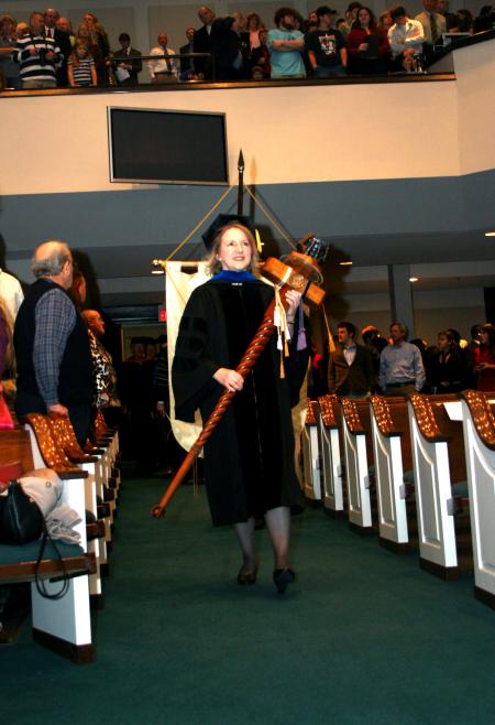 Jeannette Russ, faculty of the year and engineering professor, carries the mace during the fall commencement services.  - Photo by Kristi McMurry Woody