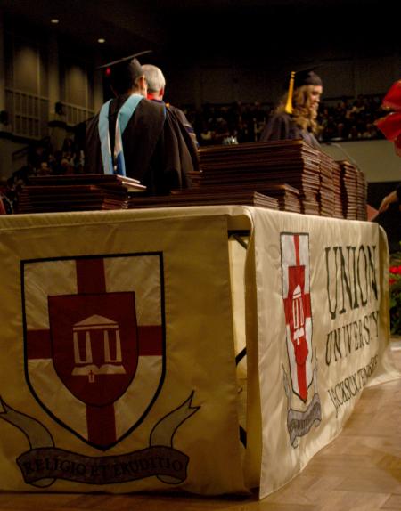 Graduates receive their diplomas from President Dockery at the fall commencement service on December 19, 2008. - Photo by Angela Abbamonte