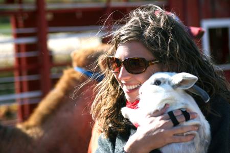 Rachel Moore, senior English major, holds a rabbit at the petting zoo.  The petting zoo was one of the many fun things to do during Arts in the Park. - Photo by Kristi McMurry Woody