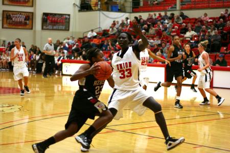 Sophomore center Zeinab Chan plays defense against Azusa Pacific (Calif.) University during the Jackson Rotary Classic.  - Photo by Kristi McMurry Woody