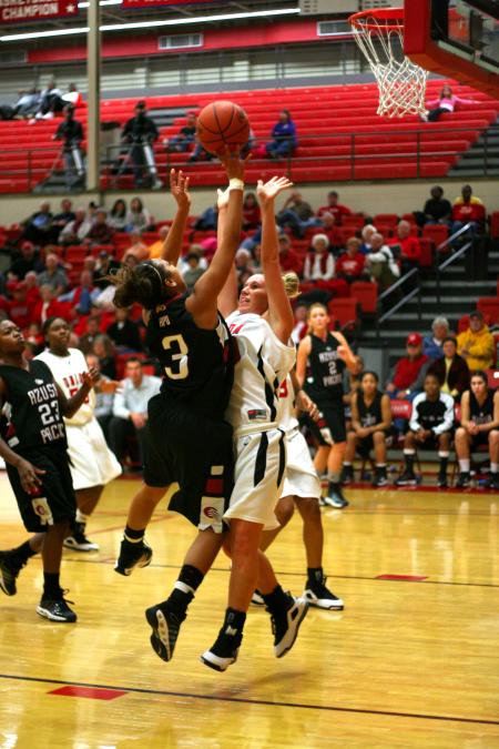 Kayla Hudson, sophomore guard, goes up to block a shot during the Lady Bulldog's win over Azusa Pacific (Calif.) University during the Jackson Rotary Classic.  - Photo by Kristi McMurry Woody