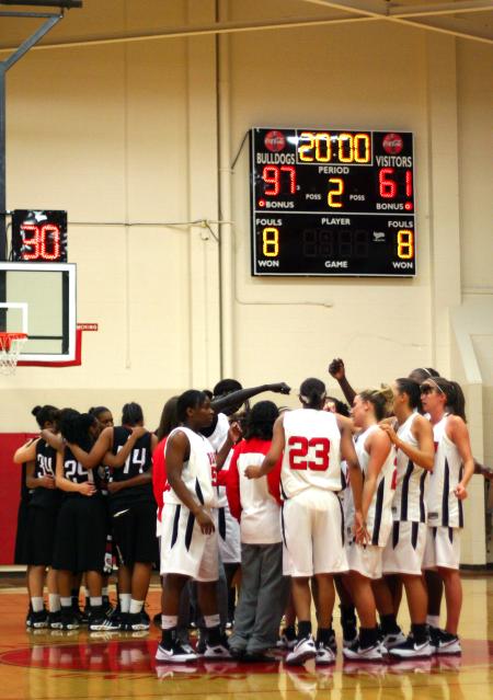 Azusa Pacific and Union teams huddle together after the third game of the Rotary Classic. Union won the game 97-61.  - Photo by Kristi McMurry Woody
