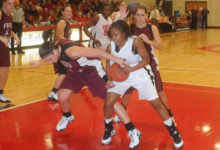 Junior guard Christina Ray fights for a rebound in the Lady Bulldog's 79-50 win over Freed-Hardeman (Tenn.) University. - Photo by Morris Abernathy