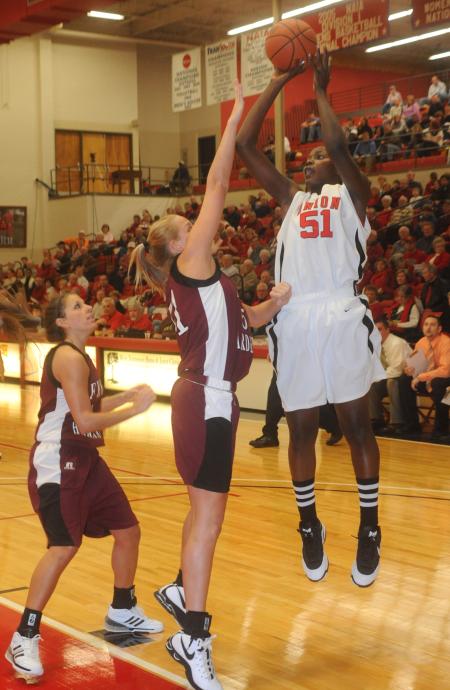 Senior center Josephine Owino shoots over defenders in Union's 79-50 win over Freed-Hardeman (Tenn.) University. - Photo by Morris Abernathy
