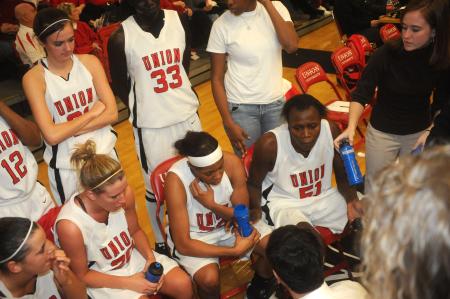 The Lady Bulldogs listen to instruction during a time out. - Photo by Morris Abernathy