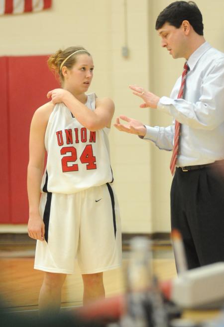 Sophomore guard Laura Crittendon listens to instruction from head coach Mark Campbell. - Photo by Morris Abernathy