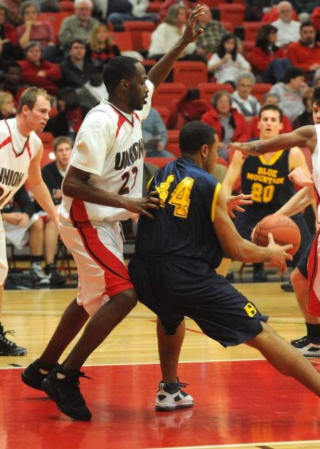 Junior forward Greg Truvillion (23) plays defense in Union's 118-71 win over Blue Mountain (Miss.) College. - Photo by Morris Abernathy