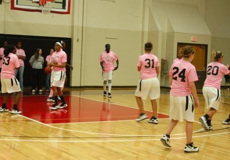 The Union Lady Bulldogs warm-up in their pink t-shirts during the WBCA's Pink Zone Breast Cancer Awareness game. - Photo by Steven Aldridge