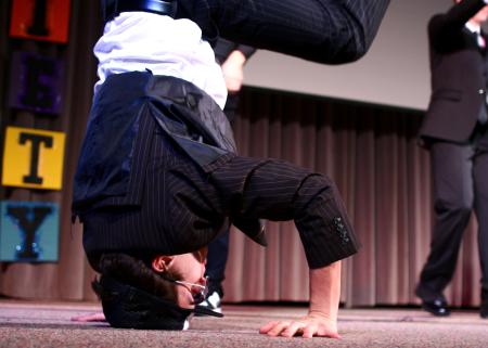 The men of Alpha Tau Omega used a Men in Black theme for their variety show act, which included many interesting dance moves. - Photo by Kristi McMurry Woody
