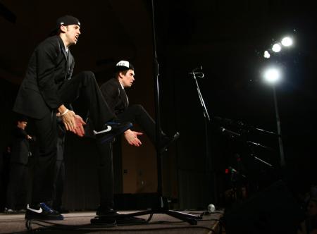 The men of Alpha Tau Omega used a Men in Black theme for their variety show act, which included many interesting dance moves. - Photo by Kristi McMurry Woody