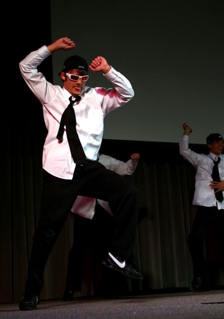 The men of Alpha Tau Omega used a Men in Black theme for their variety show act, which included many interesting dance moves. - Photo by Kristi McMurry Woody