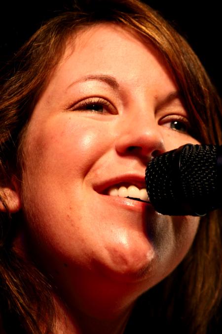 Libby Ford, senior accounting major, sings a Taylor Swift song while the judges decide who will win awards at the 2009 SAC Variety Show. - Photo by Kristi McMurry Woody