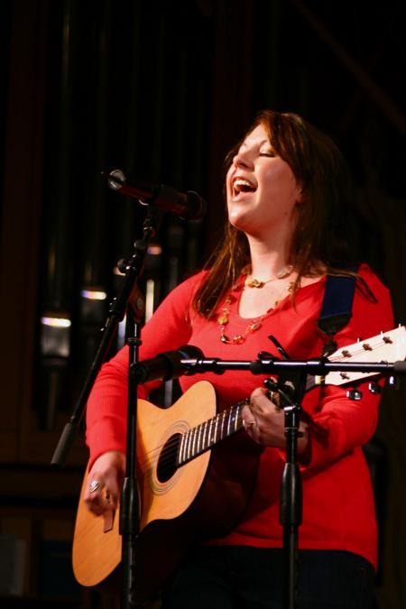 Libby Ford, senior accounting major, sings a Taylor Swift song while the judges decide who will win awards at the 2009 SAC Variety Show. - Photo by Kristi McMurry Woody