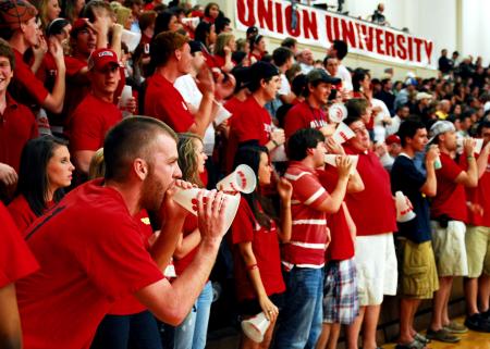 Fans cheer for Union at the TranSouth Conference Tournament Finals against Freed-Hardeman.  Students were instructed to wear red for a 'red out.' - Photo by Kristi McMurry Woody