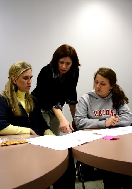Karen Martin, associate professor of languages, works with students in the Language capstone class. - Photo by Kristi McMurry Woody