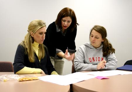 Karen Martin, associate professor of languages, works with students in the Language capstone class. - Photo by Kristi McMurry Woody
