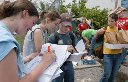 Sophomore Meredith Williams (left) and Union alumna Julie Boyer map out the relief efforts of Union student volunteers in East Jackson. - Photo by Jim Veneman