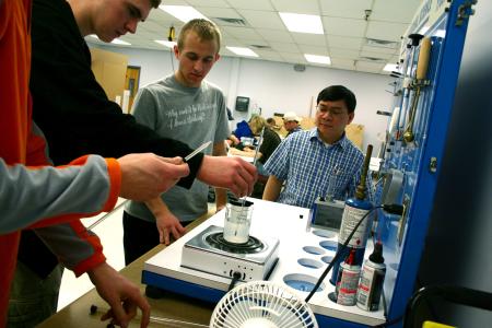 Don Van (right), engineering chair, supervises an experiment in the engineering lab. - Photo by Kristi McMurry Woody