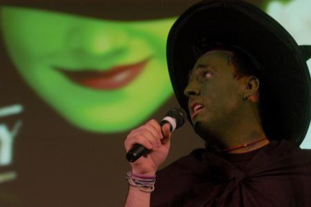 Scott McSwain, junior Spanish major, sings with the men of Lambda Chi Alpha in the SAC Variety Show. - Photo by Angela Abbamonte