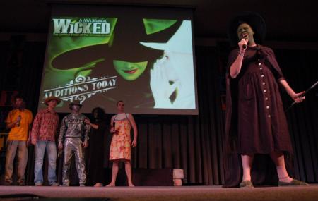 Scott McSwain, junior Spanish major, sings with the men of Lambda Chi Alpha in the SAC Variety Show. - Photo by Angela Abbamonte