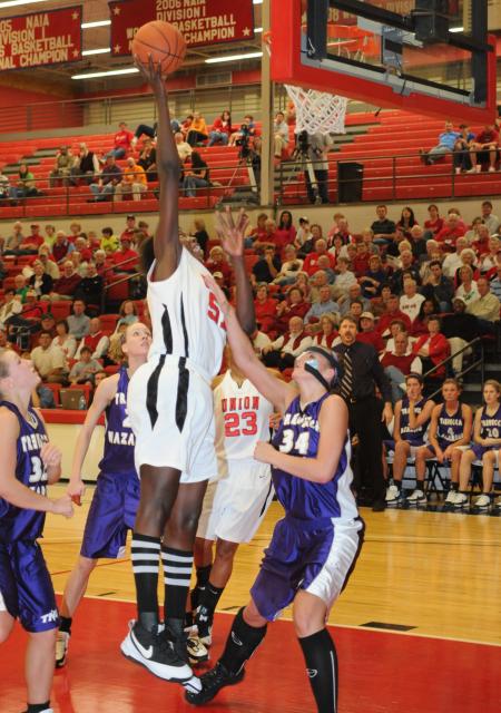 Josephine Owino gets a rebound against her Trevecca Nazarene opponent during the TranSouth Conference Tournament. - Photo by Morris Abernathy