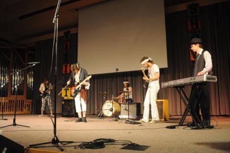 Andrew Norman, junior philosophy major, performs with his band members during the SAC Variety Show. - Photo by Morris Abernathy