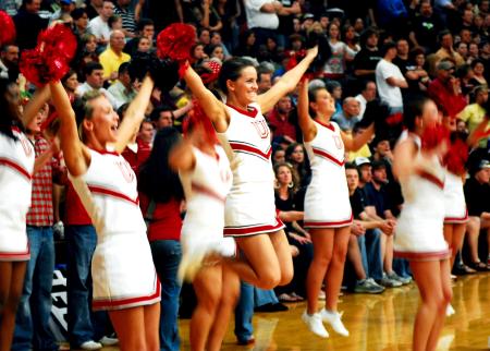 The Union Cheerleaders celebrate after a shot is made in the TranSouth Conference Tournament Finals against Freed-Hardeman. - Photo by Kristi McMurry Woody