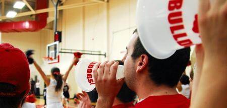 Fans cheer for Union at the TranSouth Conference Tournament Finals against Freed-Hardeman. Students were instructed to wear red for a 'red out.' - Photo by Kristi McMurry Woody