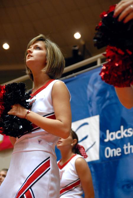 Ashley Freeland anxiously watches the action during the semifinals of the 2009 NAIA tournament. - Photo by Kristi McMurry Woody