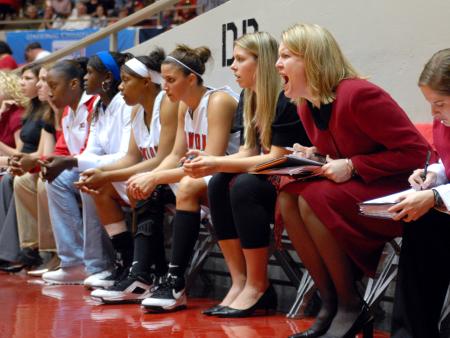 Assistant coach Katie Woodruff yells out direction during the championship of the 2009 NAIA tournament. - Photo by Kristi McMurry Woody