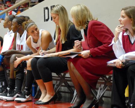 Merideth Richardson Jacobs talks with assistant coach Katie Woodruff during the championship of the 2009 NAIA tournament. - Photo by Kristi McMurry Woody
