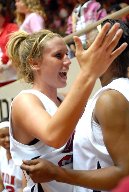 Kayla Hudson gives her teammate a hug after winning the 2009 NAIA championship. - Photo by Kristi McMurry Woody