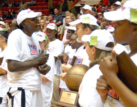 Josephine Owino celebrates with teammates after being named NAIA Player of the Year. - Photo by Kristi McMurry Woody