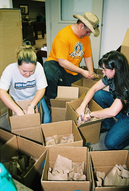 Union students pack lunches to distribute throughout downtown Jackson to families without electricity and running water. - Photo by Justin Veneman
