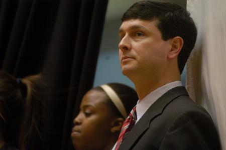 Coach Campbell awaits the game against Point Loma Nazarene in the NAIA Tournament. - Photo by Angela Abbamonte