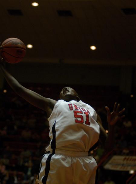 Senior Josephine Owino grabs a rebound during the NAIA quarterfinals. - Photo by Angela Abbamonte