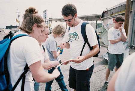 Troy Wallach, Emily Price, and Jenny Welch prepare to minister in downtown Jackson after the May 2003 tornado. - Photo by Justin Veneman
