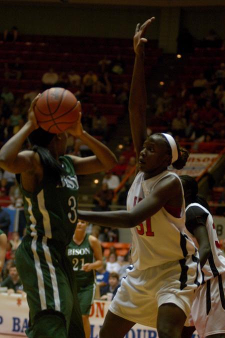 Josephine Owino plays some strong defense in the NAIA tournament semifinals against Oklahoma Baptist University. - Photo by Angela Abbamonte