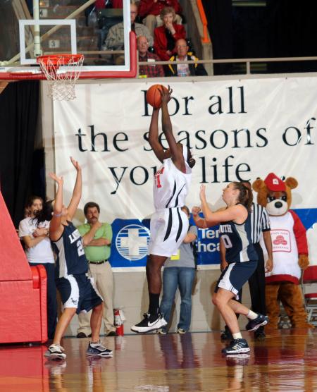 NAIA Player of the Year Josephine Owino gets a rebound against her Lambuth University opponent during the 2009 NAIA National Championship. - Photo by Morris Abernathy
