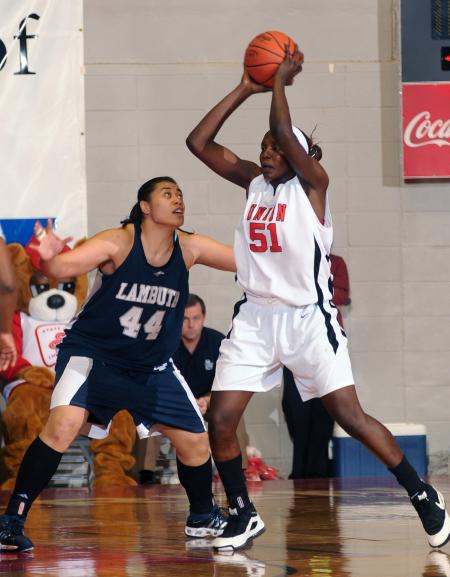 NAIA Player of the Year Josephine Owino gets a rebound against her Lambuth University opponent during the NAIA national championship game. - Photo by Morris Abernathy