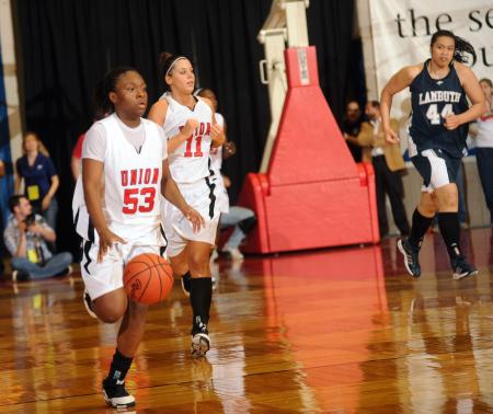 Lavanda Ross brings the ball down court during the last half of the NAIA national championship game. - Photo by Morris Abernathy