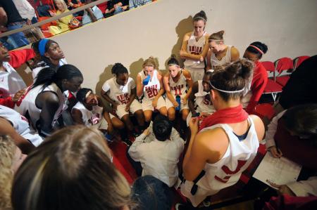 Coach Mark Campbell talks to the Lady Bulldogs during a timeout at the NAIA national championship game. - Photo by Morris Abernathy