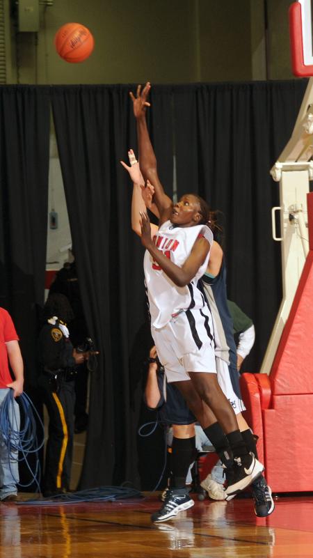 Josephine Owino goes up high for a pass during the NAIA national championship game. - Photo by Morris Abernathy