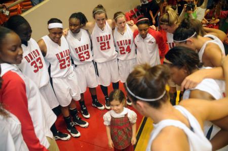 Union's Lady Bulldogs huddle up for a prayer just after winning the NAIA National Championship game. - Photo by Morris Abernathy